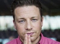 Jamie Oliver concerned but says he has “no sway” in Woolworths vegie dispute